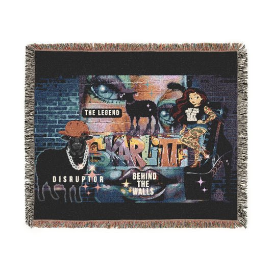 Woven blanket with artistic design featuring animals and text on a black background