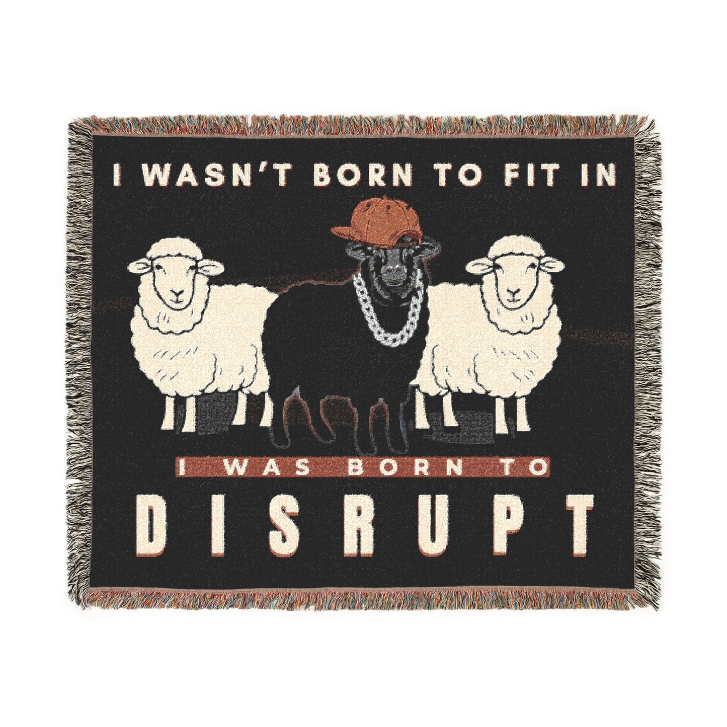 Blanket with graphic of sheep and text 'I wasn't born to fit in, I was born to disrupt' on a black background.