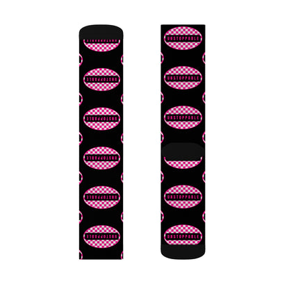 Black socks with pink checkered pattern on a white background